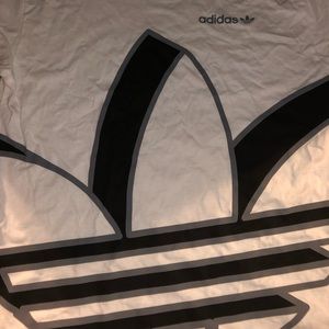 White Adidas tee shirt.